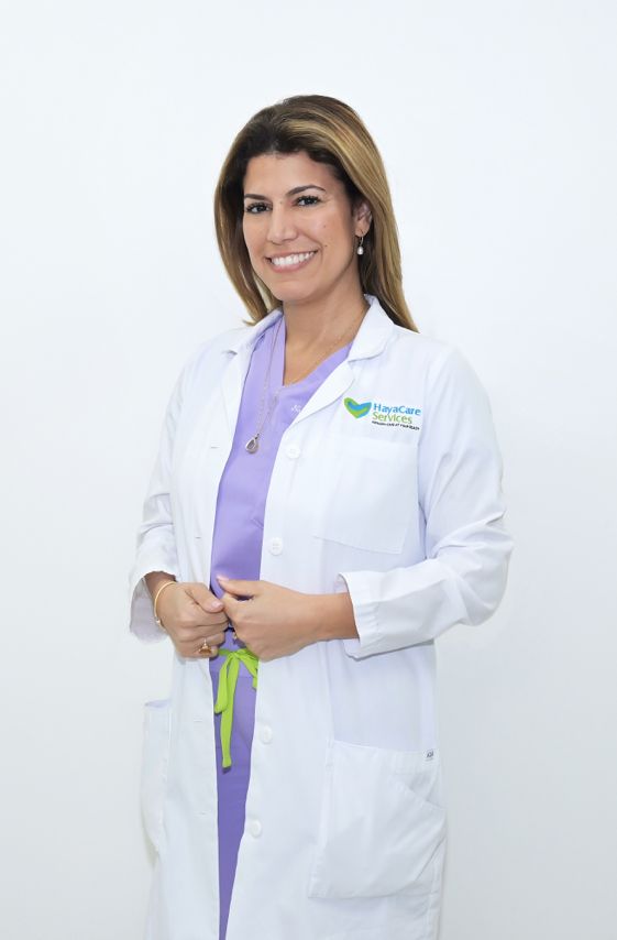 A HayaCare provider standing in a white coat